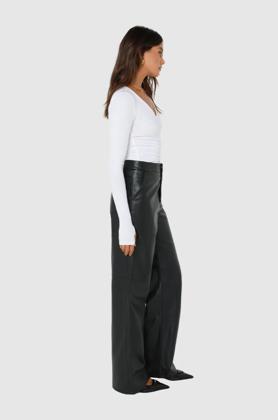 Photo of Model wearing Sadie Knit Pants in black available at UniKoncept in Waterloo side view