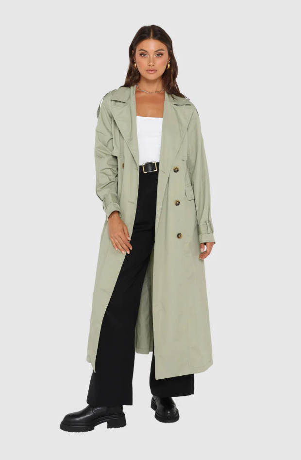 Photo of model wearing Diana Trench Coat in a sage green colour available at UniKoncept in Waterloo front view