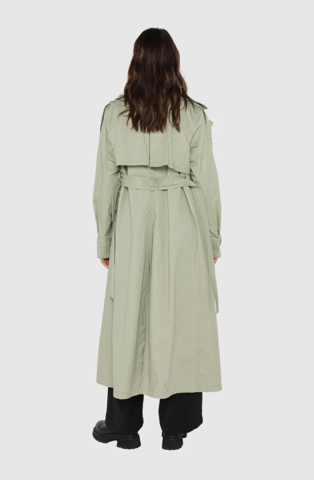 Photo of model wearing Diana Trench Coat in a sage green colour available at UniKoncept in Waterloo back view