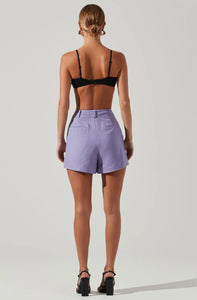 Model wearing Amiah High Waisted Shorts in purple from ASTR The Label available at UniKoncept in Waterloo photo of back view