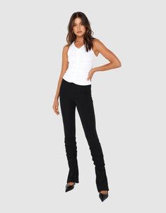 Photo of model wearing Dominique Gathered pants in black with back slit detail available at UniKoncept in Waterloo front view