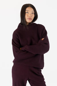 photo of model wearing chadwick ribbed mockneck sweater in a Burgundy colour available at UniKoncept in Waterloo front view