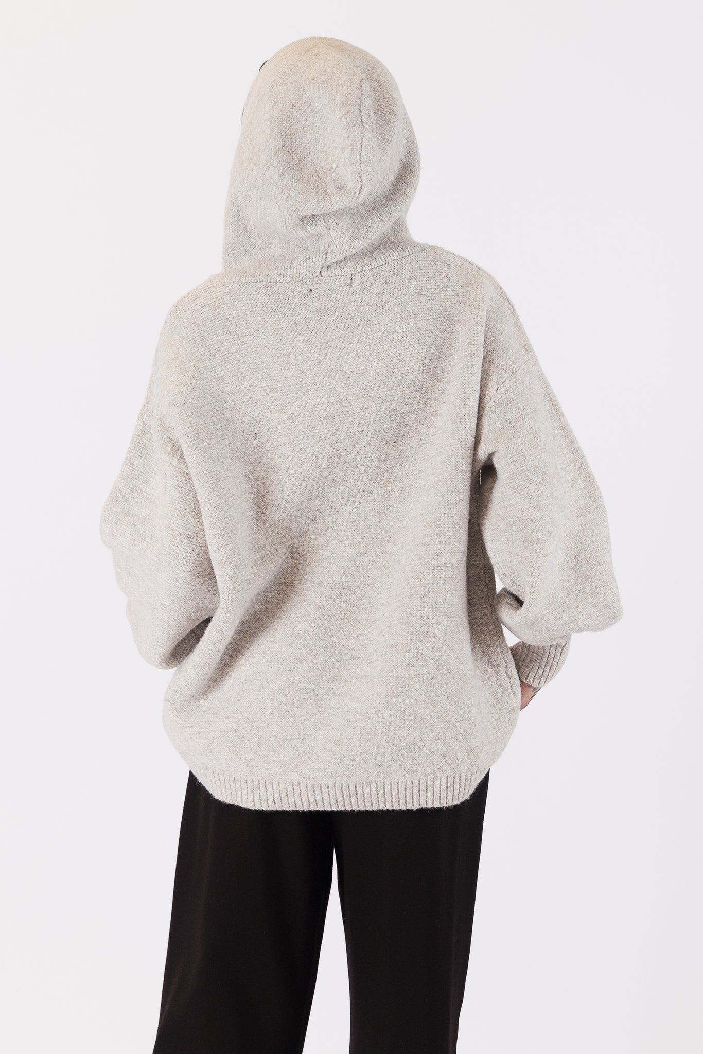 Photo of model wearing charlie eco hoodie in an oatmeal colour available at UniKoncept in Waterloo back view