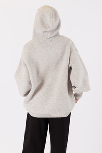 Photo of model wearing charlie eco hoodie in an oatmeal colour available at UniKoncept in Waterloo back view