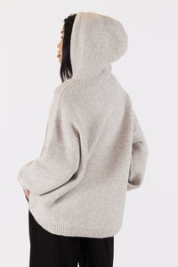 Photo of model wearing charlie eco hoodie in an oatmeal colour available at UniKoncept in Waterloo back view