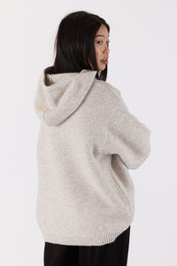 Photo of model wearing charlie eco hoodie in an oatmeal colour available at UniKoncept in Waterloo back view