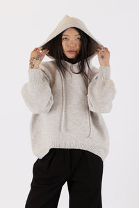 Photo of model wearing charlie eco hoodie in an oatmeal colour available at UniKoncept in Waterloo front view