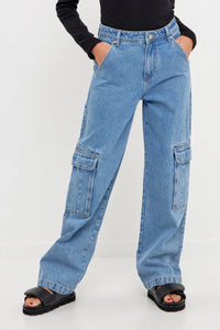 Front view of model wearing Baggy Cargo denim Featuring a straight leg, with large side cargo pockets and a baggy fit that sits mid-rise from Grey Labs available at UniKoncept in Waterloo