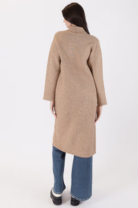 Photo of model wearing Judith Long Knit Coat in a camel colour with a button detail available at UniKoncept in Waterloo back view