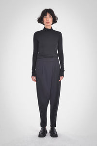 photo of model wearing Galvan A-Symmetrical Pants in black from paper label available at UniKoncept in Waterloo front view