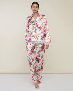Photo of model wearing Satin Long Sleeve Pant Pyjamas in a white and pink floral print with lace detailing from Rachel Parcell available at UniKoncept in Waterloo