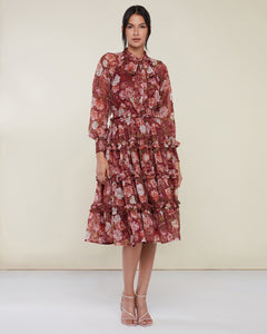 Photo of model wearing Smocked Ruffle Midi Dress in a red wine floral print from Rachel Parcell available at UniKoncept in Waterloo