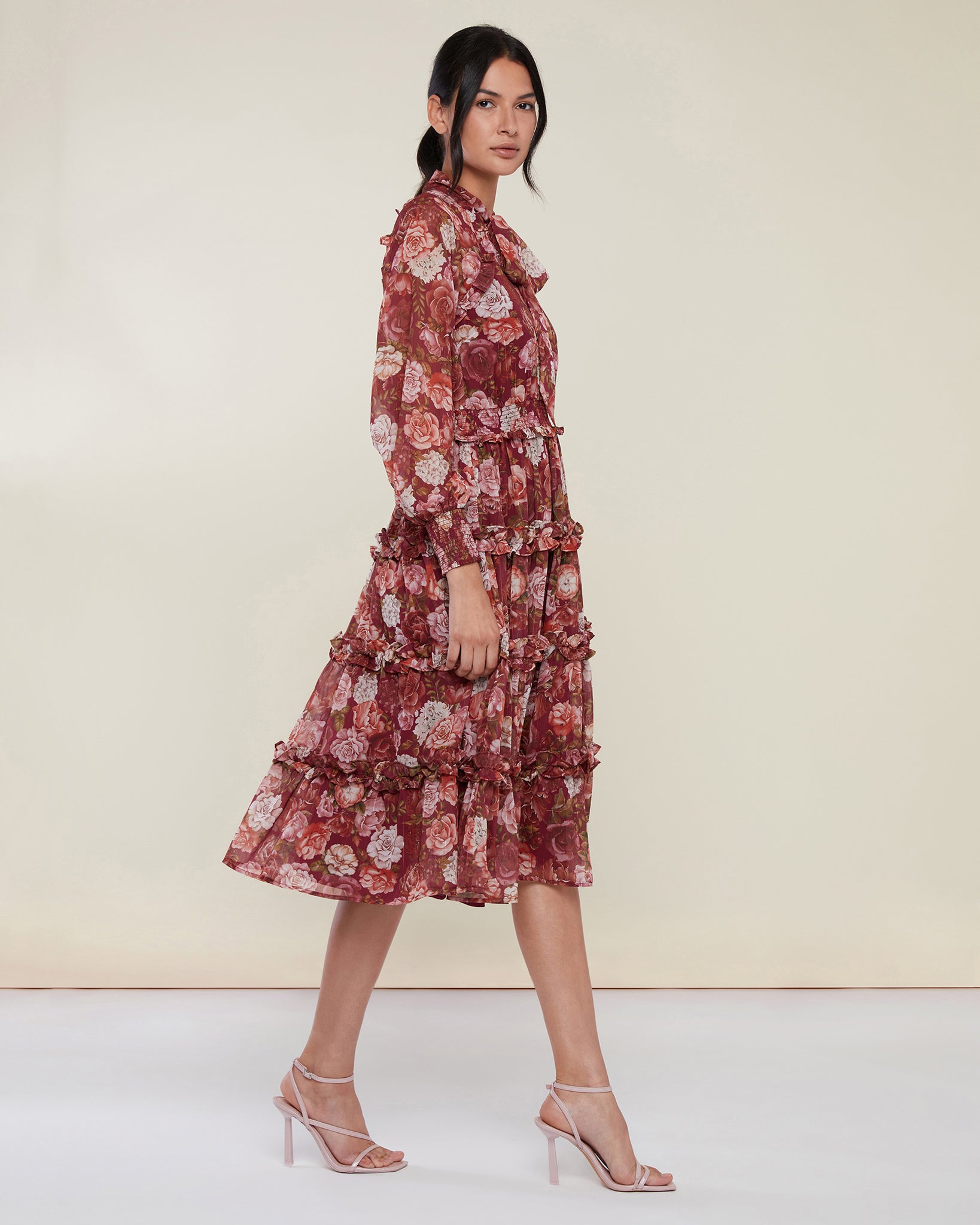 Photo of model wearing Smocked Ruffle Midi Dress in a red wine floral print from Rachel Parcell available at UniKoncept in Waterloo