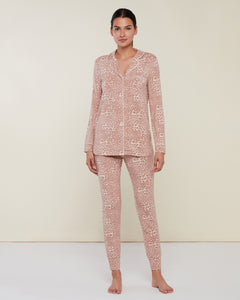 Photo of model wearing Long Sleeve Pant Jersey Pajamas with button up top in a neutral and pink leopard pattern from Rachel Parcell available at UniKoncept in Waterloo