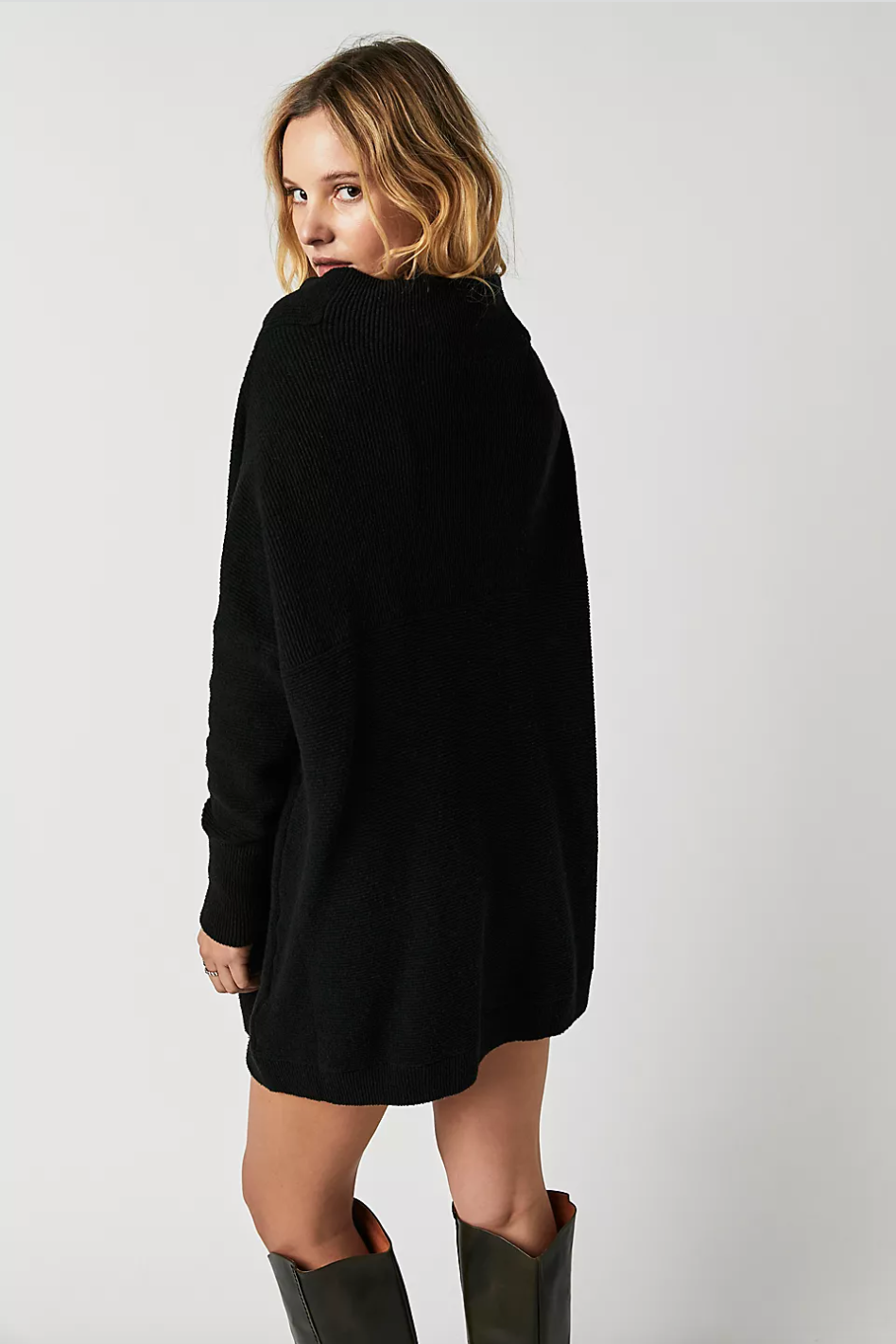 Photo of model wearing Ottoman Slouchy Tunic in the colour Black from Free People available at UniKoncept in Waterloo