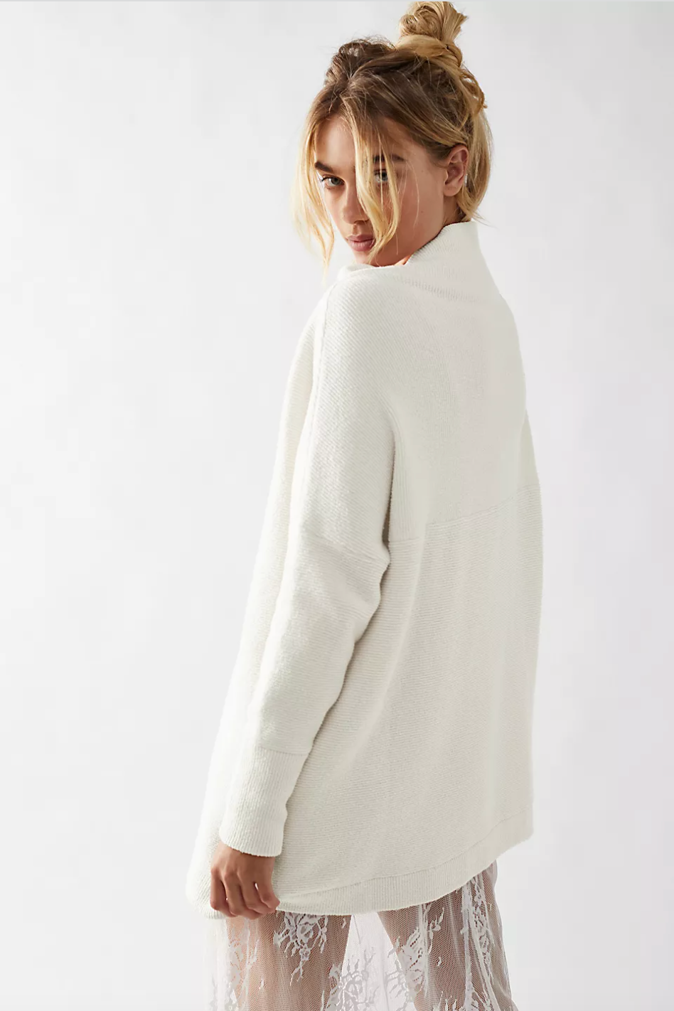 Photo of model wearing Ottoman Slouchy Tunic in the colour Ecru from Free People available at UniKoncept in Waterloo