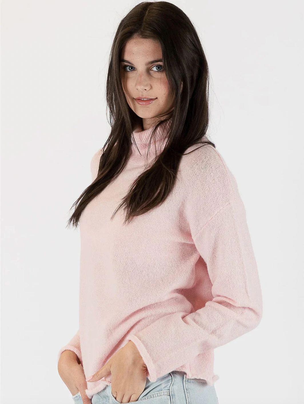 Photo of model wearing Mila Eco Lightweight Knit Sweater in a pastel pink available at UniKoncept in Waterloo