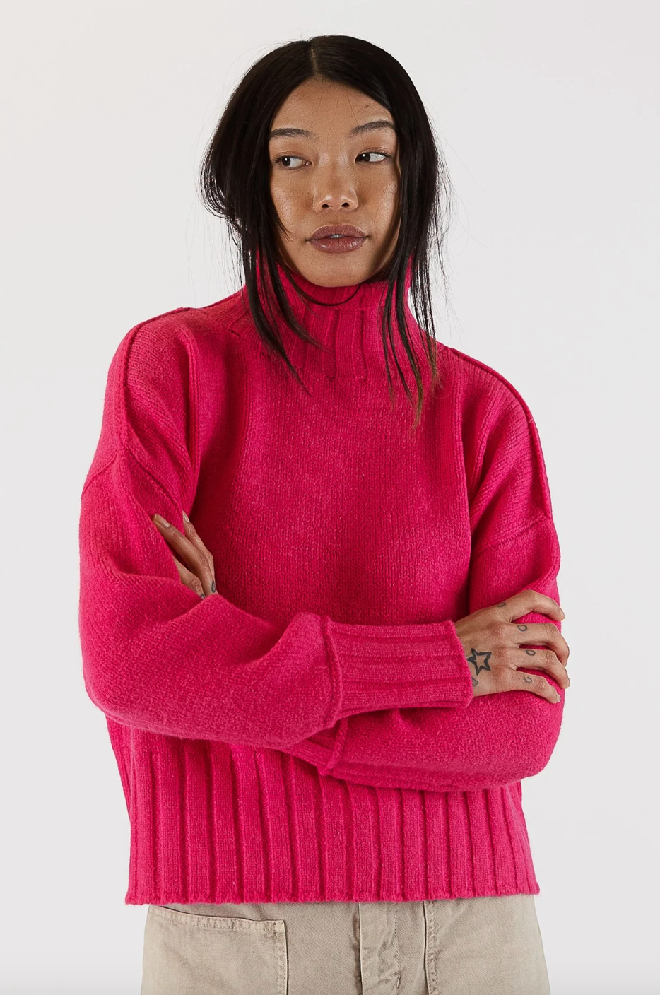 Photo of model wearing Calli Sweater in a hot pink colour featuring a mock neck available at UniKoncept in Waterloo front view