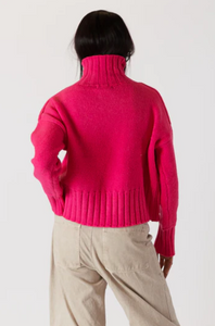 Photo of model wearing Calli Sweater in a hot pink colour featuring a mock neck available at UniKoncept in Waterloo back view