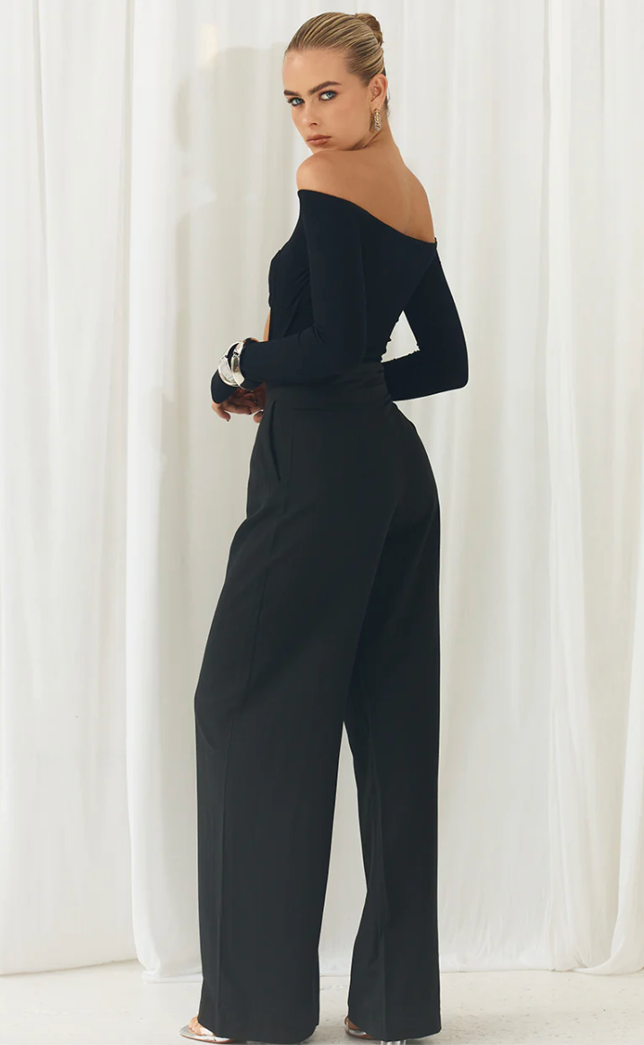 Photo of model wearing Casa bodysuit with off the shoulder and front cut out detailing in black available at UniKoncept in Waterloo back view