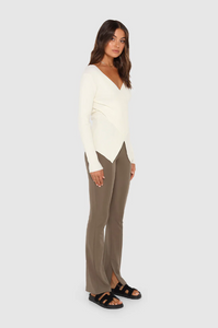 photo of model wearing Marley Knit Top in the colour milk available at UniKoncept in Waterloo side view