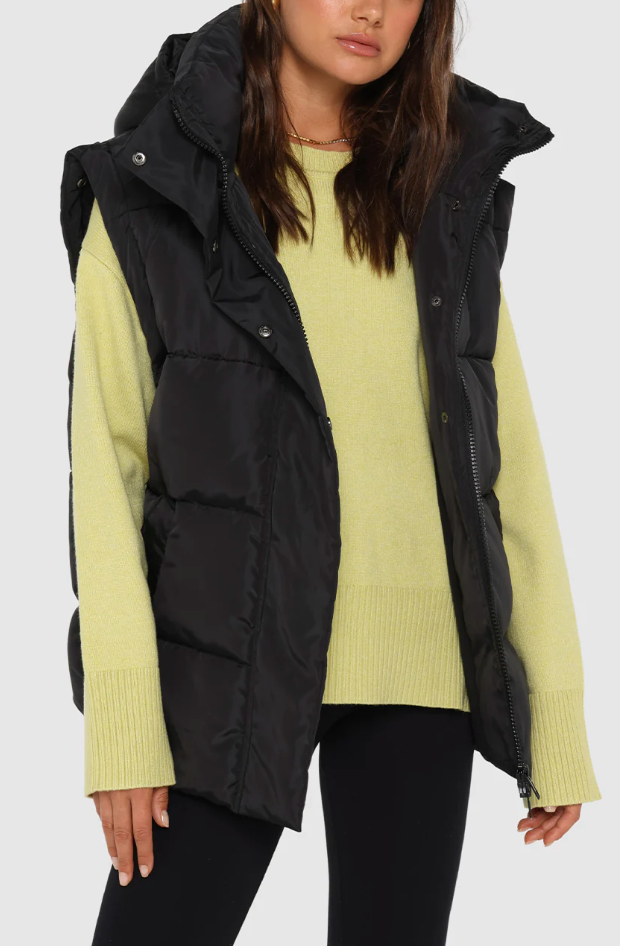 photo of model wearing jasper 3 in 1 puffer jacket in black available at UniKoncept in Waterloo front view as vest