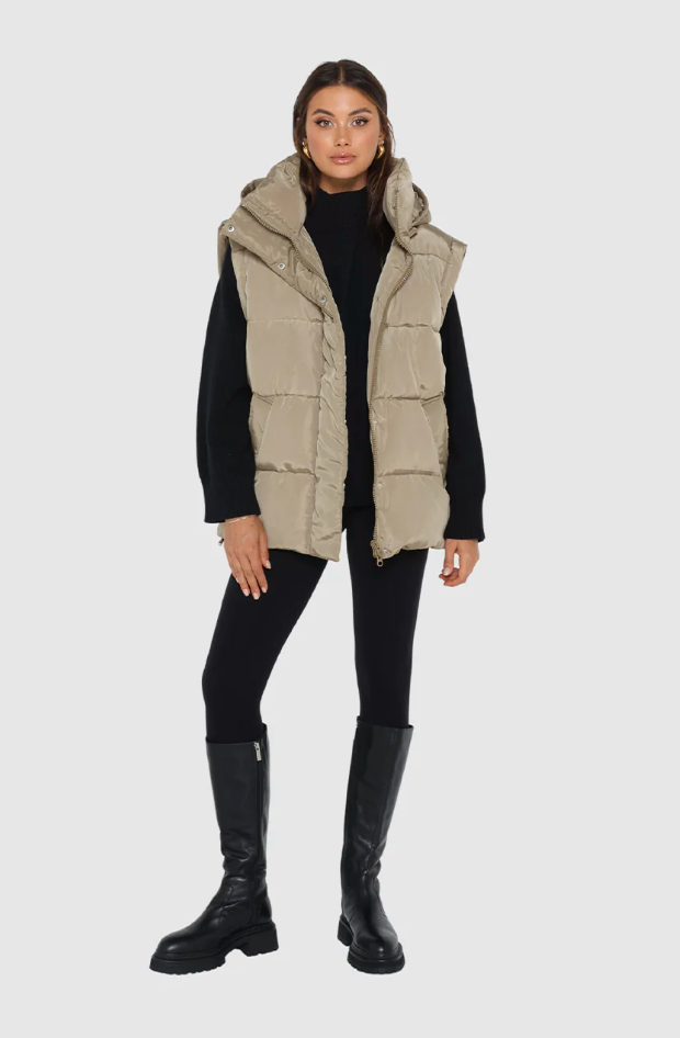 photo of model wearing jasper 3 in 1 puffer jacket in sage available at UniKoncept in Waterloo front view as vest