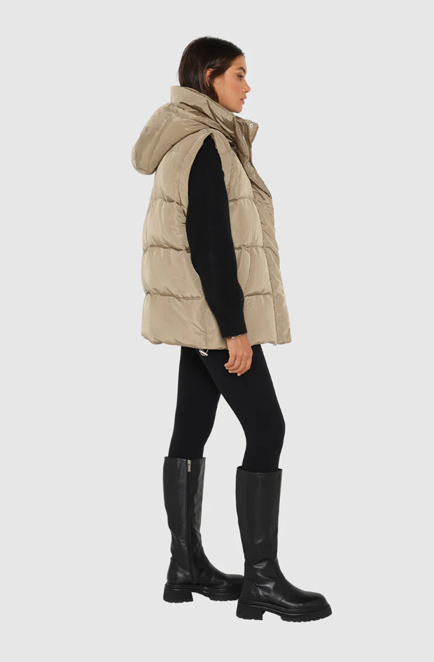 photo of model wearing jasper 3 in 1 puffer jacket in sage available at UniKoncept in Waterloo side view as vest