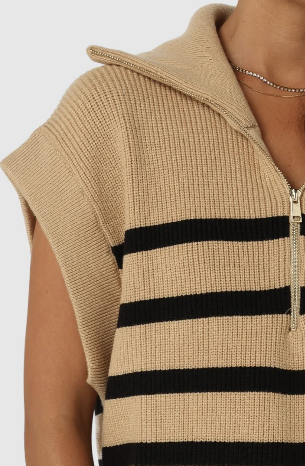 photo of model wearing owen knit vest in a camel colour with black stripes featuring a quarter zip available at UniKoncept in Waterloo close up detail photo