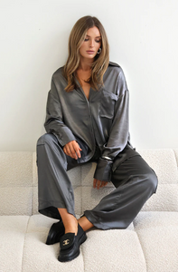 photo of model wearing Zura Satin shirt in a charcoal grey colour paired with the addison pants available at UniKoncept in Waterloo