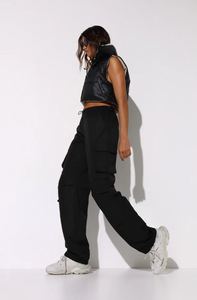 Photo of model wearing dean cargo pants in black available at UniKoncept in Waterloo side view