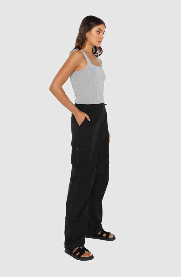 Photo of model wearing dean cargo pants in black available at UniKoncept in Waterloo side view