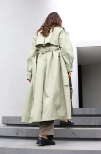 Photo of model wearing Diana Trench Coat in a sage green colour available at UniKoncept in Waterloo back view