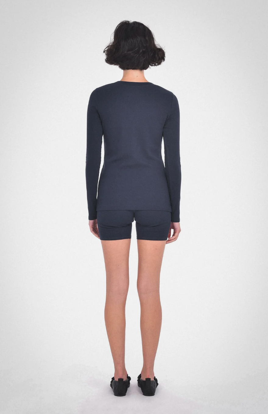 photo of model wearing lisa long sleeve top in midnight blue from paper label available at UniKoncept in Waterloo back view