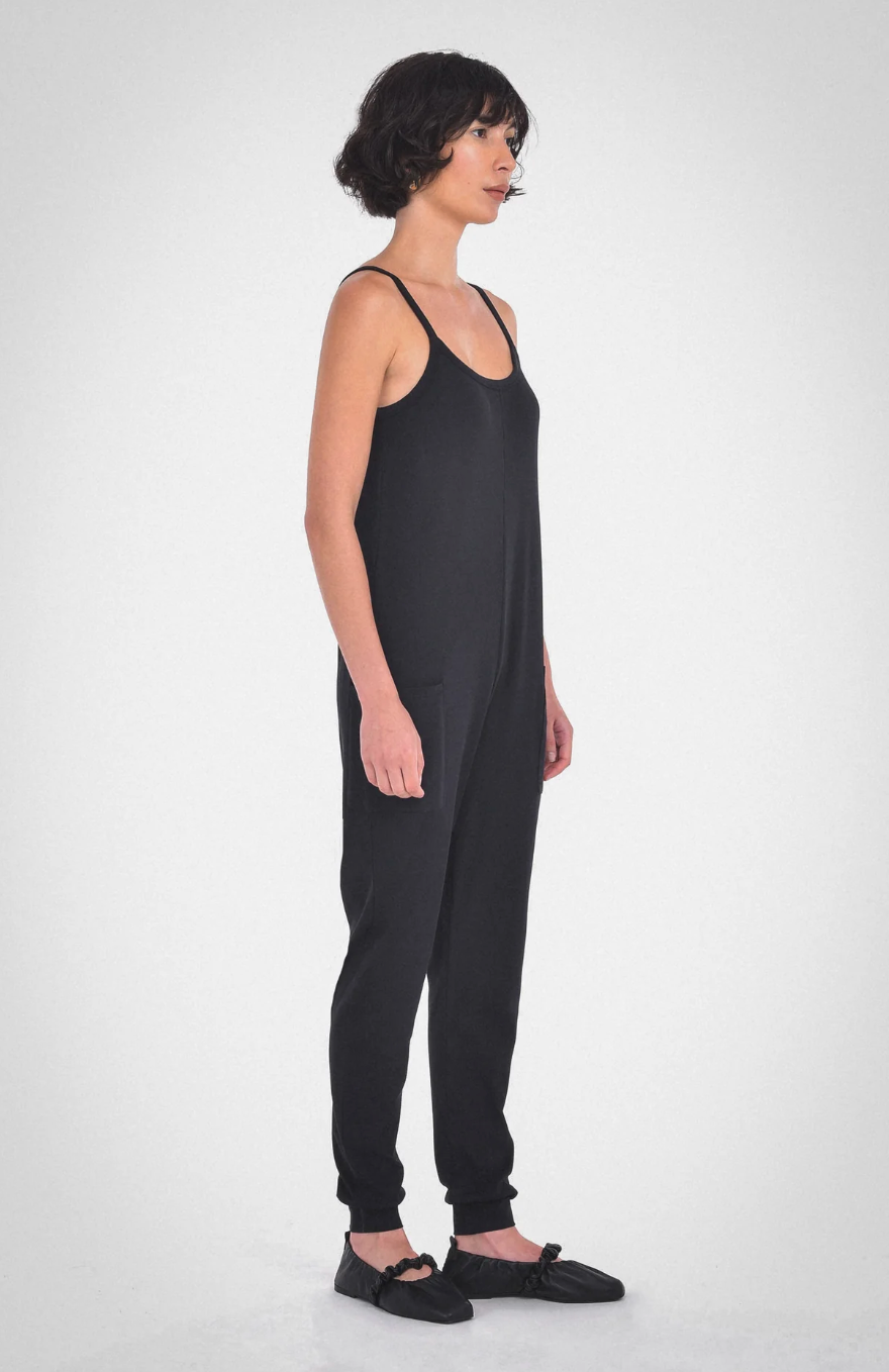 photo of model wearing the nicola jumpsuit in black from paper label available at UniKoncept in Waterloo side view
