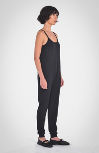photo of model wearing the nicola jumpsuit in black from paper label available at UniKoncept in Waterloo side view