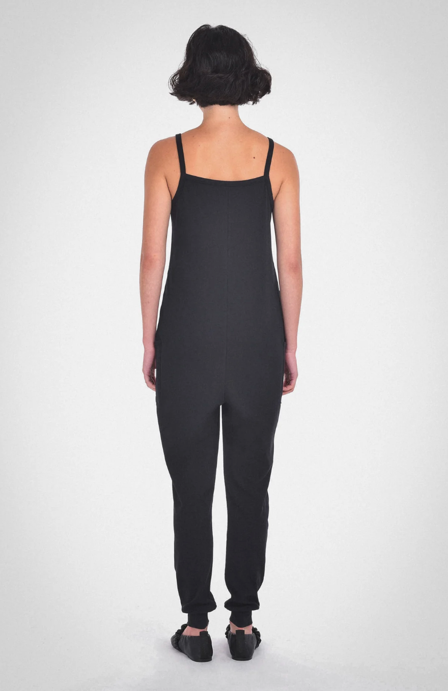 photo of model wearing the nicola jumpsuit in black from paper label available at UniKoncept in Waterloo back view