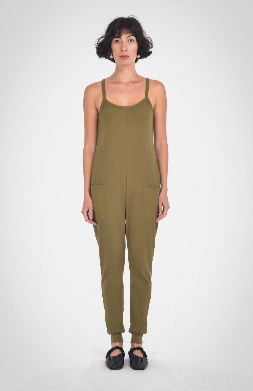 photo of model wearing the nicola jumpsuit in moss from paper label available at UniKoncept in Waterloo front view