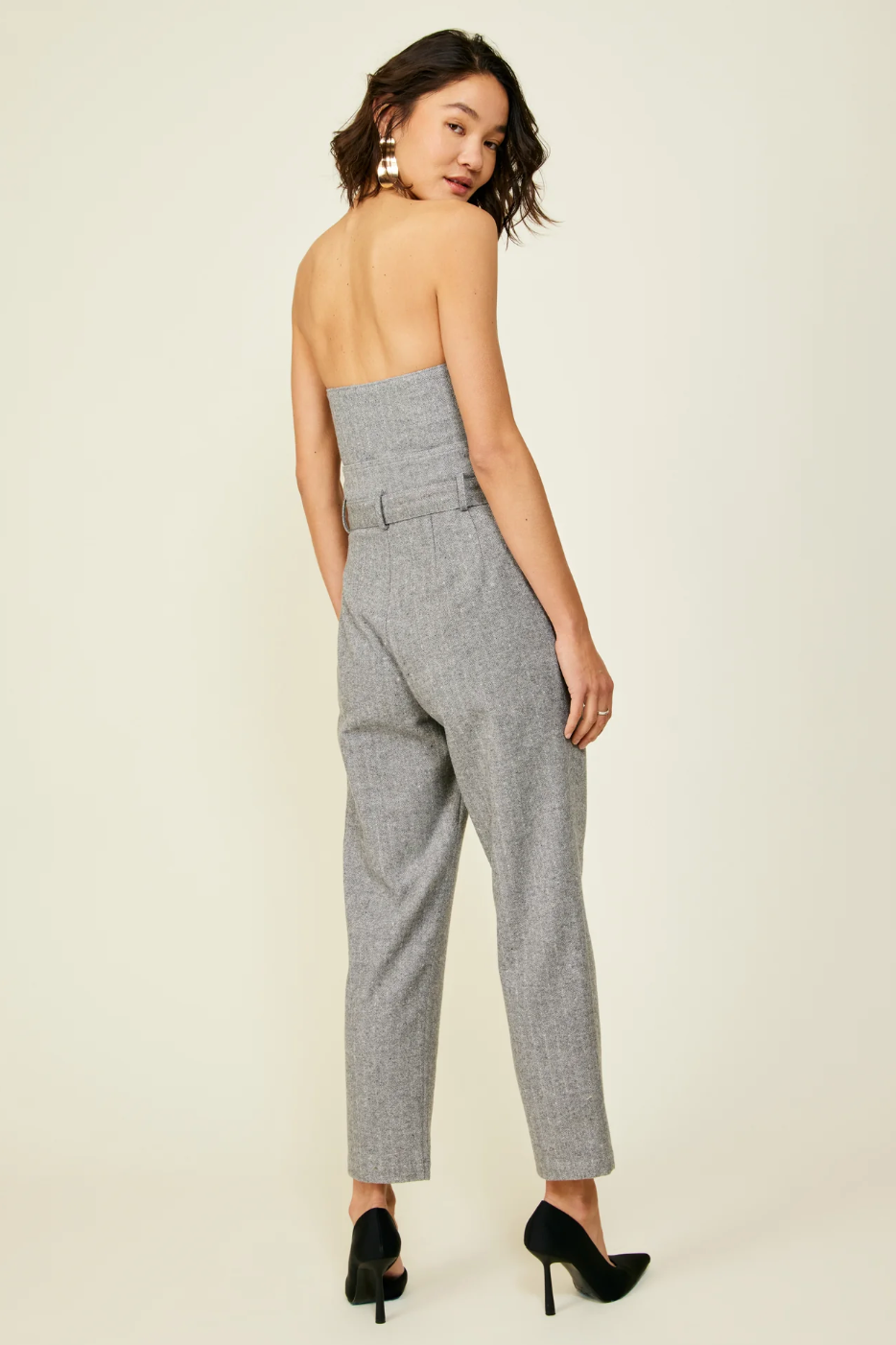 Photo of model wearing Paola Pants in grey featuring a highwaist and fabric belt available at UniKoncept in Waterloo back view