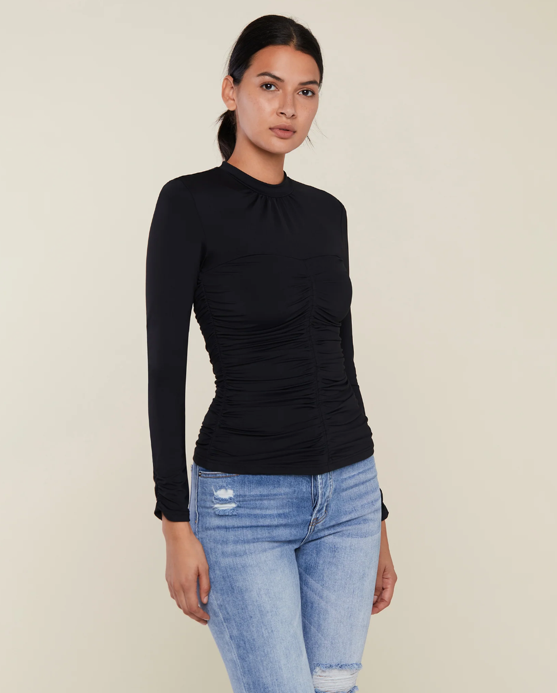 Photo of model wearing Long Sleeve Ruched Mock Neck in black from Rachel Parcell available at UniKoncept in Waterloo