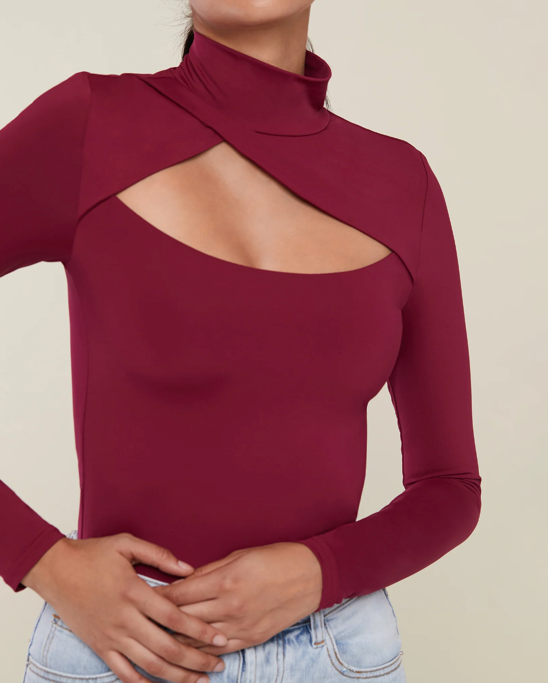 Photo of model wearing cut out bodysuit in red wine colour from Rachel Parcell available at UniKoncept in Waterloo