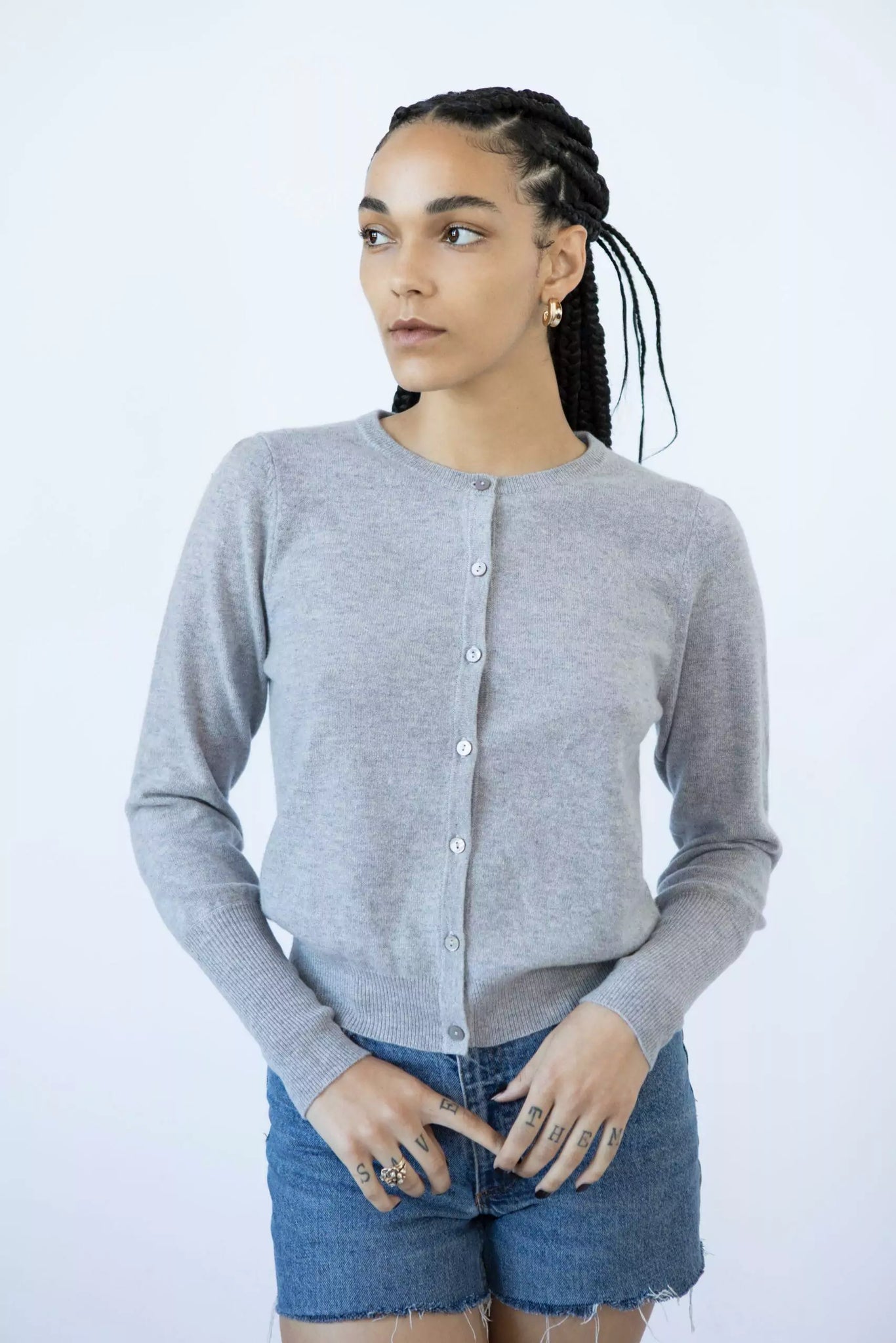 Photo of Model wearing Lyla Cashmere Cardigan featuring buttons up the front in the colour stormy (grey) available at UniKoncept in Waterloo