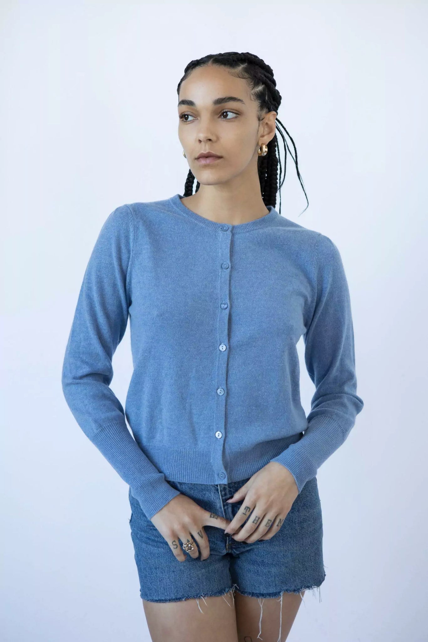 Photo of Model wearing Lyla Cashmere Cardigan featuring buttons up the front in the colour billy jean (blue) available at UniKoncept in Waterloo