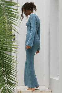Photo of model wearing caprice maxi dress in blue available at UniKoncept in Waterloo back view