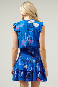 photo of model wearing Katrina dress in blue abstract print with dropped waist detailing available at UniKoncept in Waterloo back view