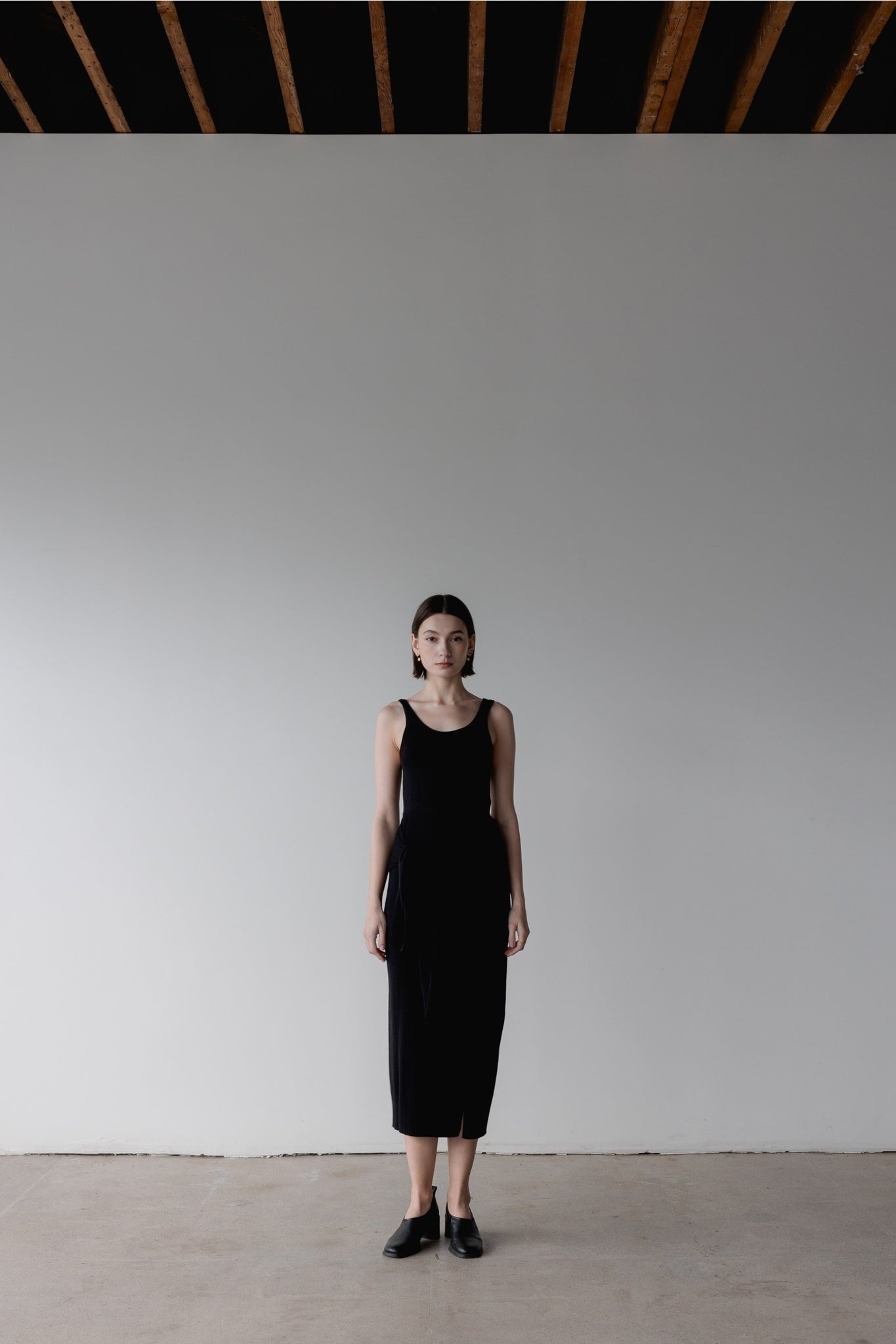 Model wearing Amelia Dress in Black with Tie Detailing available at UniKoncept in Waterloo