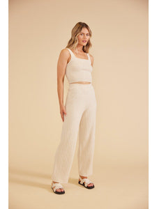 Model wearing Paige Knit Pants in cream from MinkPink available at UniKoncept in Waterloo