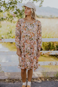 Model wearing Patsy Drop Waist Nursing Dress in floral pattern from Roolee available at UniKoncept in Waterloo