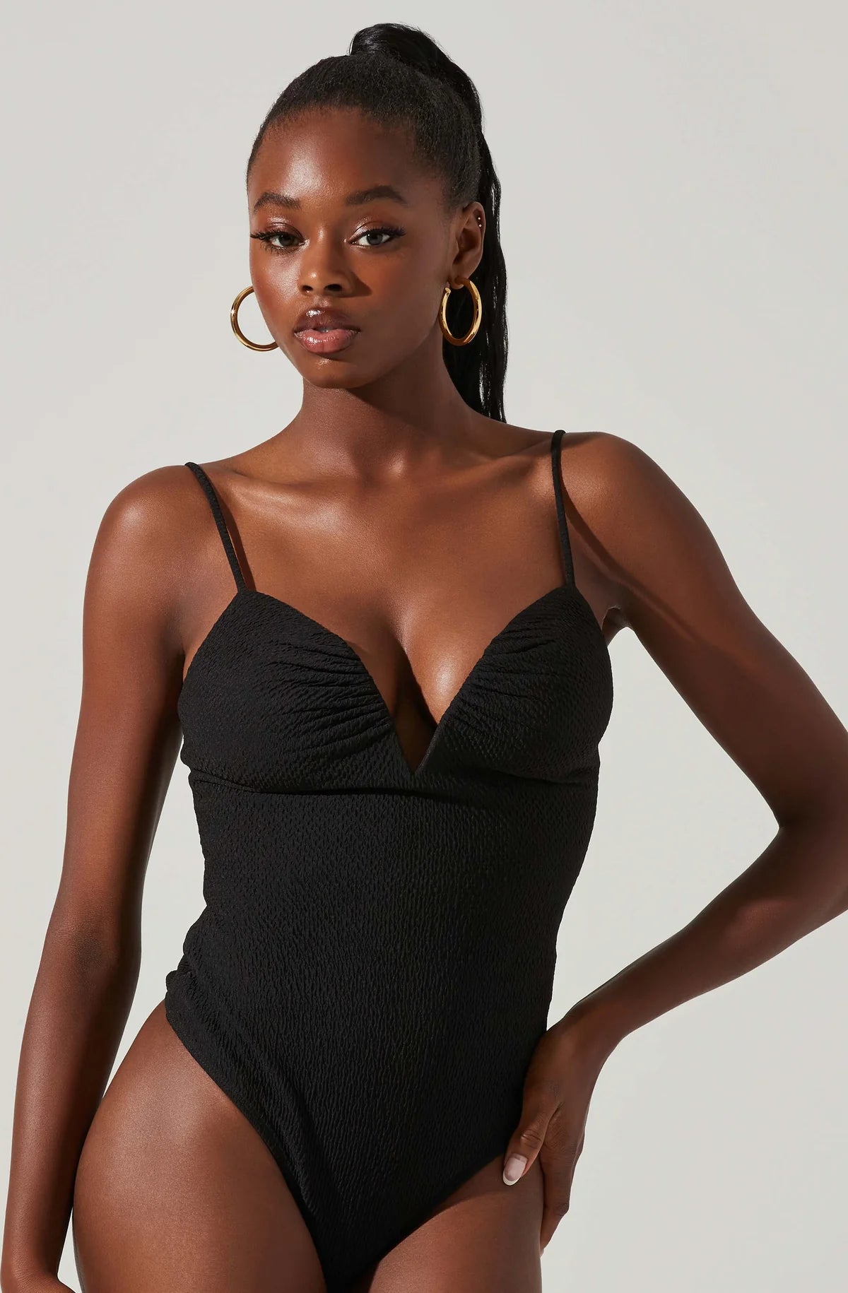 Model wearing Fia Crinkled Plunge Bodysuit in Black from ASTR The Label available at UniKoncept in Waterloo