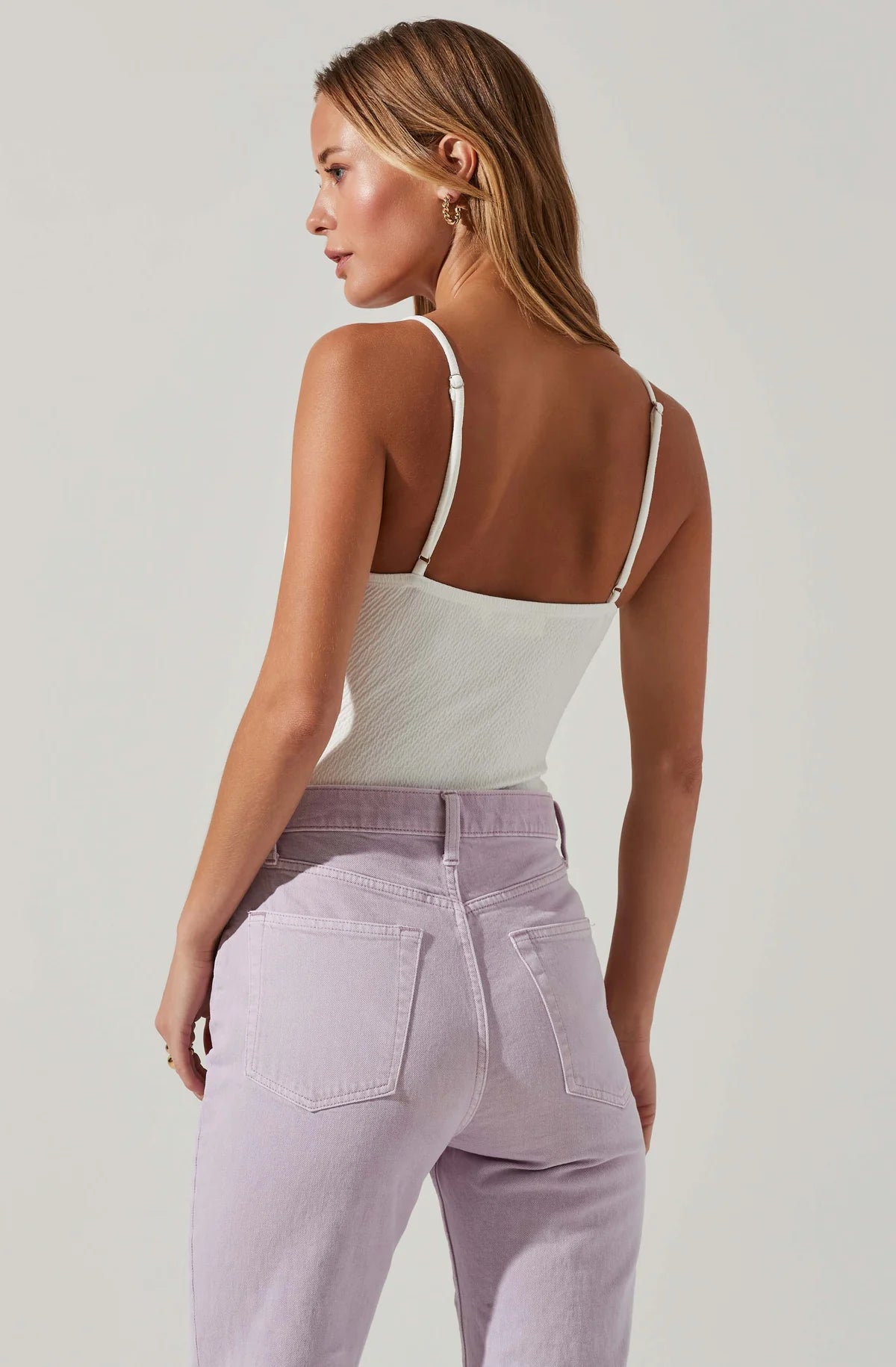 Model wearing Fia Crinkled Plunge Bodysuit in White from ASTR The Label available at UniKoncept in Waterloo back view